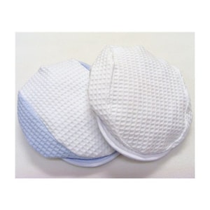 May include: Two white waffle-textured hats with blue trim. One hat has a blue trim around the entire hat, while the other has a blue trim around the brim.