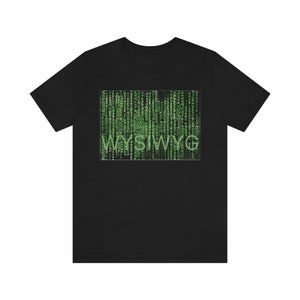 May include: Black t-shirt with a green graphic of the text "WYSIWYG" surrounded by a matrix-style code.