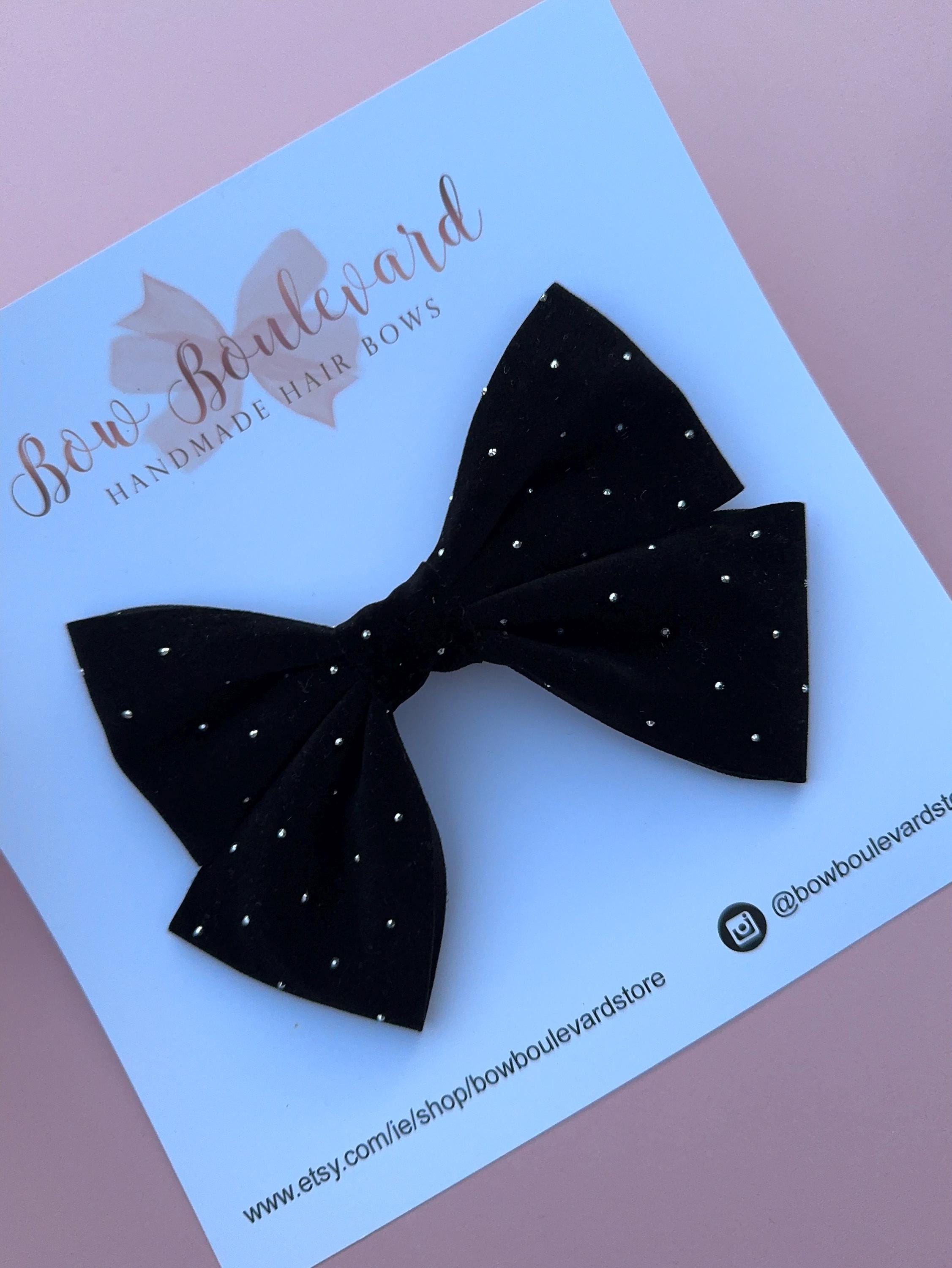 Black velvet bow with silver stud detail