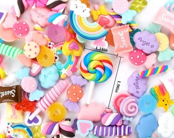 May include: A collection of colorful candy-themed charms, including lollipops, candy canes, hearts, and rainbows. The charms are made of polymer clay and are approximately 1.18 inches in diameter and 1.96 inches tall.