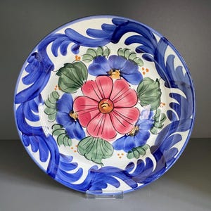 Spanish pottery wall plate, decorated with a big colourful hand painted floral pattern in red blue and green, large hanging plate - 10.25&quot;
