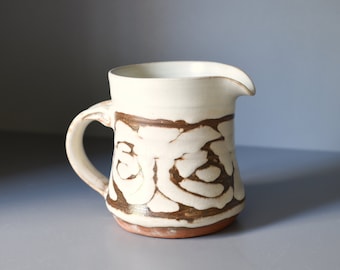 Little pottery jug with white and brown swirly pattern, rustic textured creamer  - 8cm