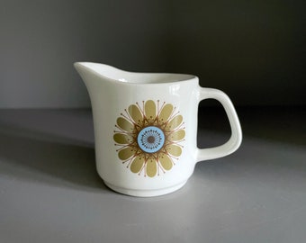 J&G Meakin creamer, mini little jug in the Studio Galaxy pattern with a single green 1970s flower. Designed by Jessie Tait in 1973 - 100ml