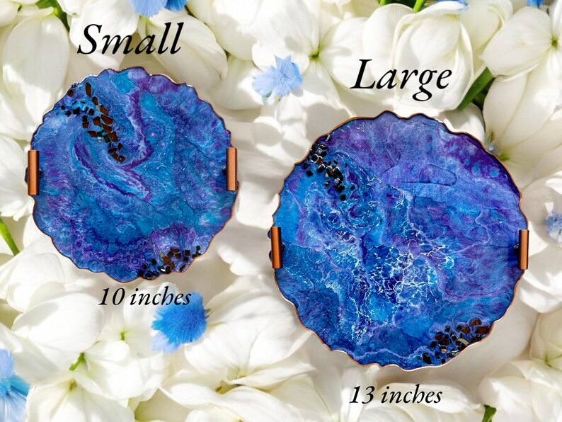 May include: Two decorative resin trays with blue and purple swirls, copper handles, and a textured edge. The small tray is 10 inches in diameter, and the large tray is 13 inches in diameter. The word "Small" and "Large" are written above each tray.