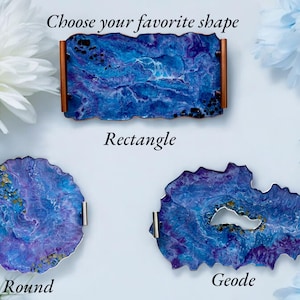 May include: Three decorative trays in different shapes: rectangle, round, and geode. Each tray features a blue and purple marbled design with metallic accents. The rectangle tray has wooden sides. The image includes the text "Choose your favorite shape".