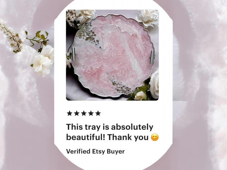 May include: A pink and white resin tray with a scalloped edge and silver handles. The tray has a marbled effect and is decorated with gold glitter.