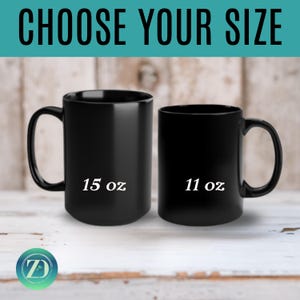 May include: Two black ceramic mugs, one labeled "15 oz" and the other "11 oz", are displayed against a light wood background. The text "CHOOSE YOUR SIZE" is at the top. A logo is at the bottom.