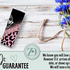 May include: A black and pink tumbler with a leopard print pattern. The tumbler has a white top and a straw. The words "Love It Guarantee" are written on the bottom left of the image.