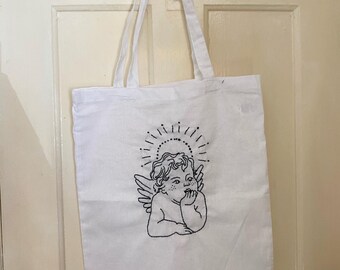 Hand embroidered white cherub tote