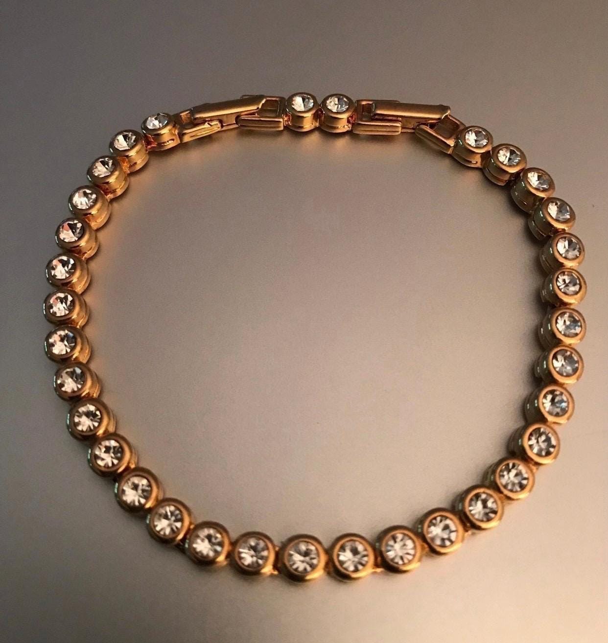 Reserved for Brian! Do not buy!!! Vintage Avon Signed Gold plated Round Link Cubic Zirconia Tennis Bracelet Double Clasps.See Photos!
