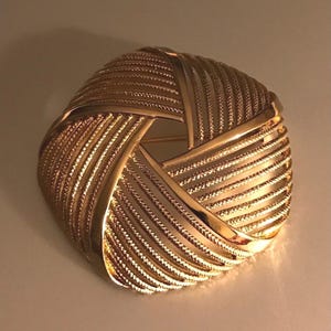 Vintage Monet Signed Gold Plated Open work Textured Domed Brooch.
