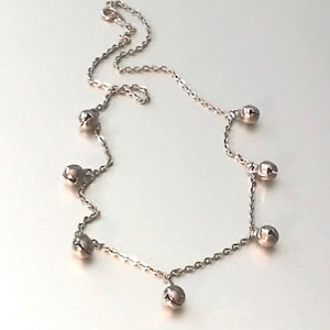 Collar vintage con dije de bola colgante de Avon firmado