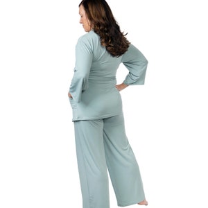 May include: A light blue two-piece pajama set with a long-sleeved top and wide-leg pants.
