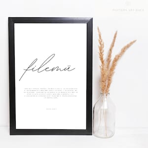 May include: Black framed print with the word "filemu" in cursive script. The print includes a Bible verse from Philemon 1:1-2.