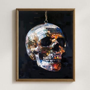 May include: A framed wall art print featuring a human skull covered in reflective, multi-colored mirrored tiles, resembling a disco ball. The skull is suspended against a solid black background, creating a high-contrast visual effect.