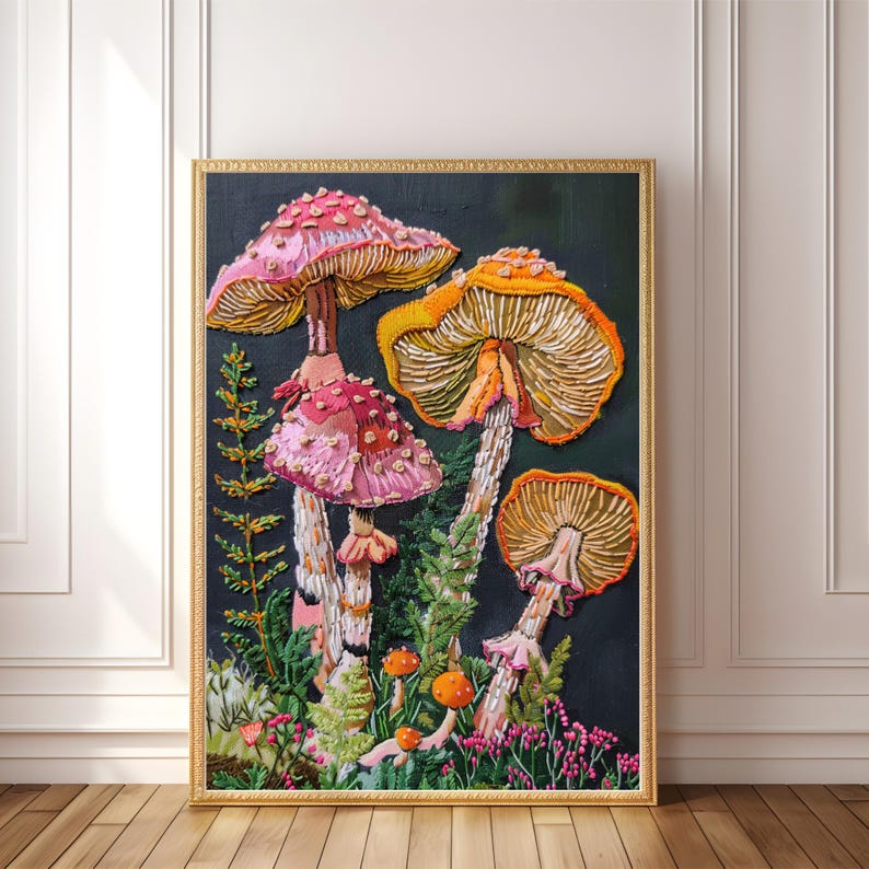 May include: A framed embroidery artwork featuring a cluster of colorful mushrooms with pink and orange caps against a dark background. The mushrooms are depicted with intricate details and textures, creating a whimsical and vibrant scene.