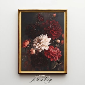 May include: A framed floral print featuring a bouquet of dark red, white, and peach-colored flowers. The flowers are set against a dark background, and the frame is gold. The print is labeled "GOTH HOUSE printery".