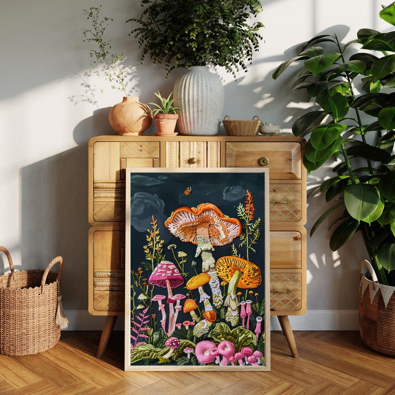 May include: A framed print of a colorful illustration of mushrooms in a forest setting. The mushrooms are various shades of orange, pink, yellow, and white. The background is a dark blue with a few white clouds.