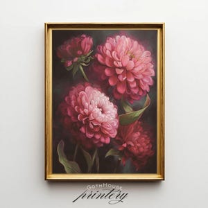 May include: A framed floral print featuring vibrant pink flowers with dark green leaves against a dark background. The artwork is in a gold frame and includes the text "GOTHHouse printery" at the bottom.