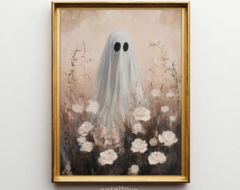 May include: A framed painting depicts a ghost figure draped in a white sheet with black eye holes, standing in a field of white roses and tall grass. The artwork has a vintage aesthetic, with a gold frame and the text "GOTHHouse printery" at the bottom.
