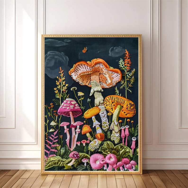 May include: A framed embroidery artwork depicting a variety of colorful mushrooms in a dark forest setting. The mushrooms are arranged in a cluster, with some standing tall and others lying on the ground. The artwork is framed in a gold frame.