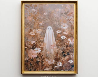 May include: A framed print featuring a whimsical ghost figure amidst a field of flowers in shades of beige, white, and brown. The ghost is draped in a white sheet with two black dot eyes. The print is in a gold frame, with the text "GOTHHouse printery" at the bottom.