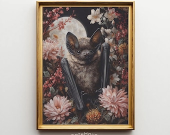 May include: A framed print featuring a bat with outstretched wings, surrounded by flowers and a full moon. The artwork has a dark, gothic aesthetic with a gold frame. The text "GOTH HOUSE printery" is at the bottom.