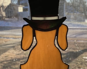 Stained glass sun-catcher dog with top hat, adds a touch of sophistication and playfulness to the overall design.