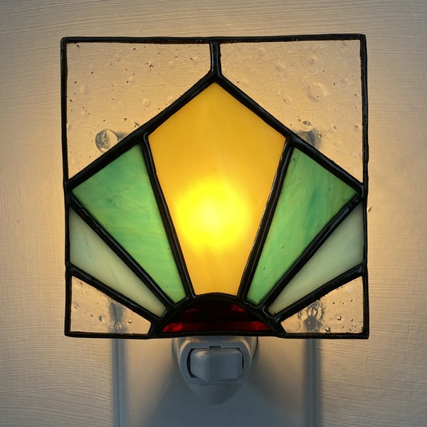Stained glass geometric style night light, offering both visual appeal and practical utility.