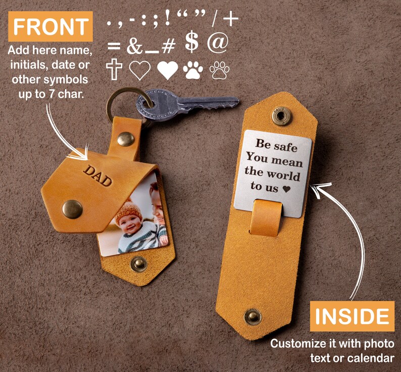 May include: A tan leather keychain with a metal key. The front of the keychain is embossed with the word "DAD" and holds a photo. The inside has a metal plate with the text "Be safe You mean the world to us".