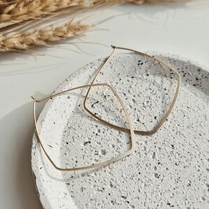 Hoop earrings large gold-coloured / made of brass / one pair of earrings / simple design / square