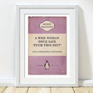 May include: A pink book cover with the title "A Wise Woman Once Said 'F*ck This Shit' and Lived Happily Ever After." The book cover also includes the words "Modern Philosophy", "Complete", "Unarridged", and "3/6". A penguin illustration is on the cover.