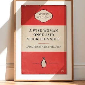 May include: A red book cover with the title "Modern Philosophy" and the text "A wise woman once said 'Fuck this shit' and lived happily ever after." The book cover also features a penguin illustration and the text "Complete" and "Unabridged".