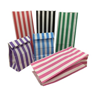 May include: Five striped paper bags in different colours. The bags are folded and arranged on a white background. The colours of the bags are red and white, black and white, green and white, purple and white, and pink and white.