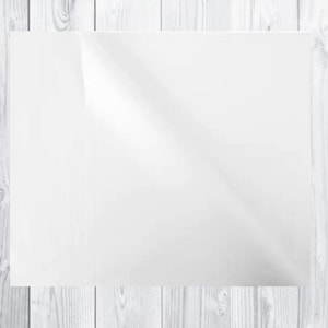 May include: A blank white sheet of paper on a white wood background.