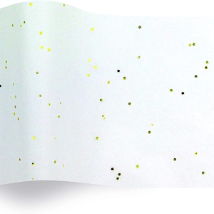 May include: White tissue paper with a scattered pattern of small gold dots.