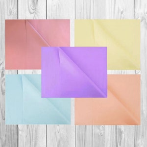 May include: Five sheets of tissue paper in different pastel colours: light pink, lavender, light blue, peach, and yellow. The tissue paper is folded in half and arranged in a grid pattern.