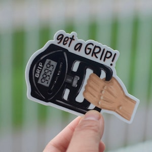 Könnte beinhalten: Ein weißer Aufkleber mit einer schwarz-weißen Illustration eines Handkraftmessers. Das digitale Display zeigt "00000 lb" an. Der Aufkleber trägt den Text "get a GRIP!" in Schwarz.