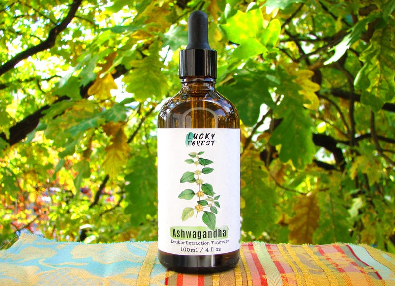 May include: A brown glass bottle with a black dropper, labeled "Lucky Forest" and "Ashwagandha Double Extraction Tincture." The label features a green plant illustration. The bottle contains 4 fl oz (118 ml).