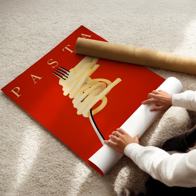 A person is rolling up a red poster with the word "PASTA" on it, which features a stylized image of spaghetti noodles.