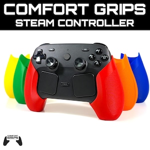 May include: A black Steam controller featuring red comfort grips attached, with additional yellow, green, orange, and blue grip attachments arranged behind it. The text COMFORT GRIPS STEAM CONTROLLER appears at the top, and a logo is at the bottom.