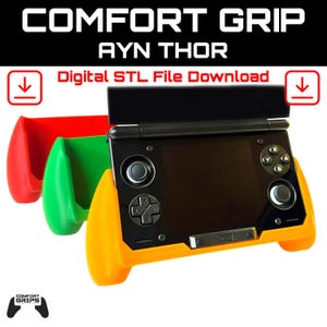 May include: A black handheld gaming device with a yellow, green, and red Comfort Grip. The device has a black screen and buttons. The text "COMFORT GRIP AYN THOR Digital STL File Download" is displayed at the top.