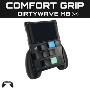 May include: Black and grey handheld music sampler with a screen and buttons. The sampler has a black and grey grip on each side. The text "DIRTYWAVE M8 (V1)" is printed on the top of the device. The text "COMFORT GRIP" is printed above the text "DIRTYWAVE M8 (V1)".