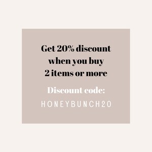 May include: A beige rectangle with black text that reads "Get 20% discount when you buy 2 items or more. Discount code: HONEYBUNCH20"