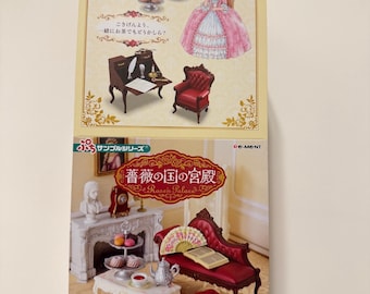 May include: A miniature dollhouse set with a Victorian theme. The box art features illustrations of furniture, a doll in a pink gown, and tea sets. The text on the box is in Japanese.