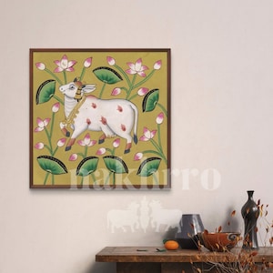 White Cow Pichwai with Lotus Flowers – Kamdhenu Painting on Golden Yellow – Hand-Painted Indian Art on Cloth (Original)