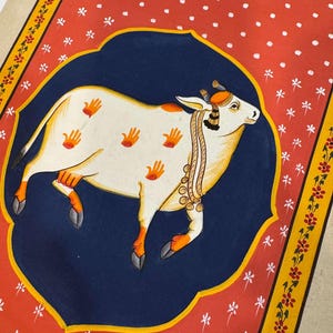 Kamadhenu Pichwai Painting | Original Indian Art on Cotton Cloth | Red & Navy Floral Frame