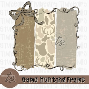 May include: A decorative frame with a bow and scrollwork. The frame features three vertical panels: a textured brown panel, a camouflage pattern panel with deer antlers, and a textured tan panel. The text "Gamo Hunting Frame" is at the bottom.