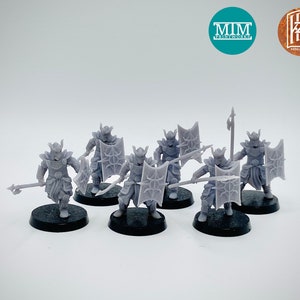 May include: A set of six grey plastic miniature figures of warriors with shields and spears. The figures are standing on black bases. The figures are from MIM Printworks and HK Miniatures.