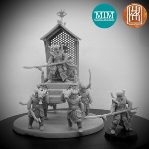 May include: A miniature figure of a warrior seated on a throne carried by four figures with dragon heads. The throne is decorated with a lattice design and the warrior is holding a spear. The figures are painted in a gray color. MIM Printworks Miniatures.